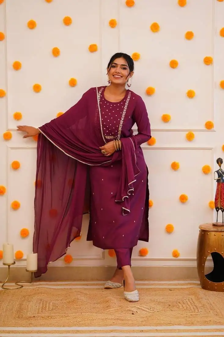 Wine colour fancy and sober embroidered salwar suit stitched